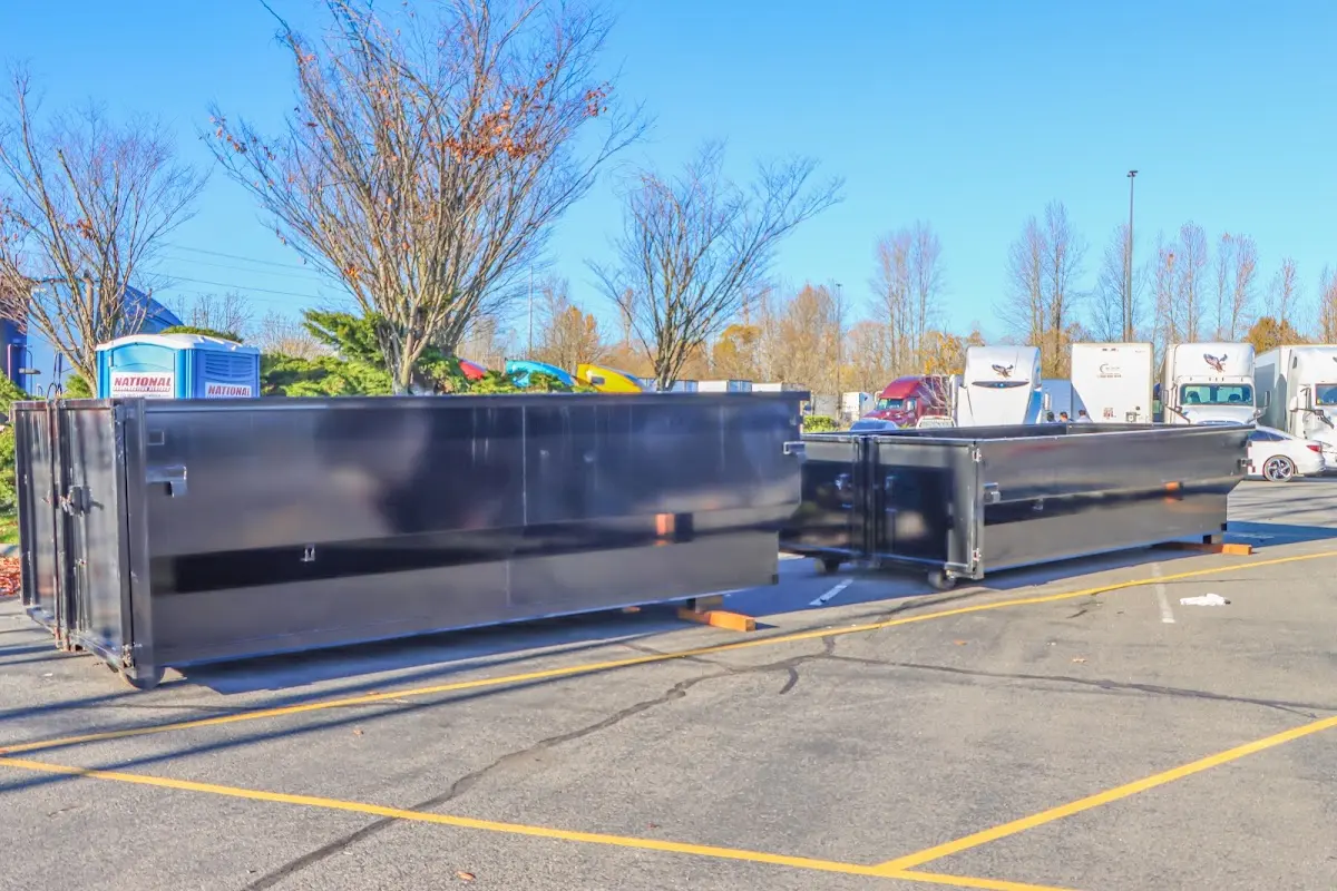 Professional dumpster rental service with roll-off container on residential driveway in Leesylvania